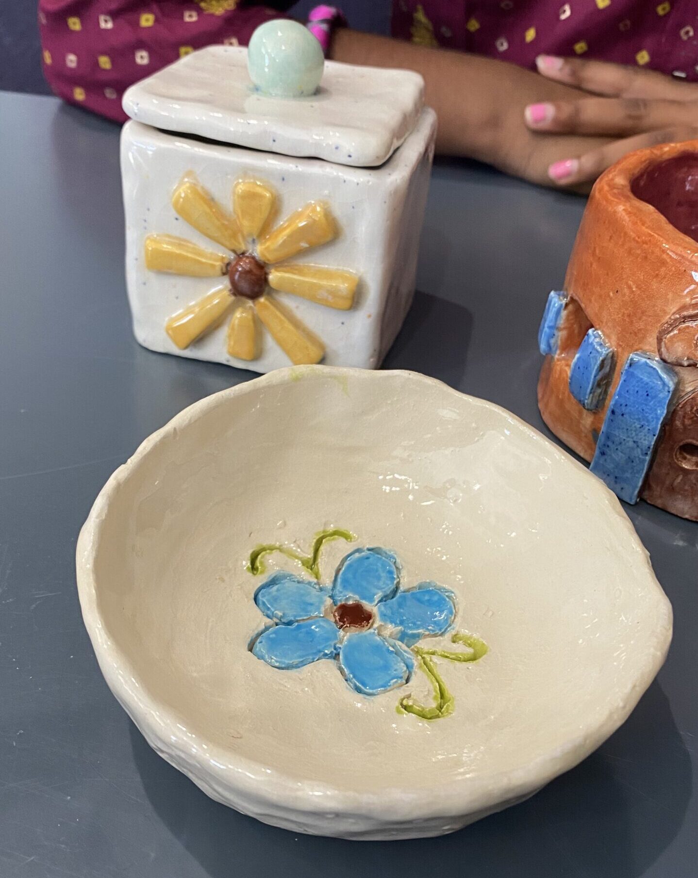 Thanksgiving art camp activity for kids in Leander area, showcasing colorful painting projects at Nilis Art Studio